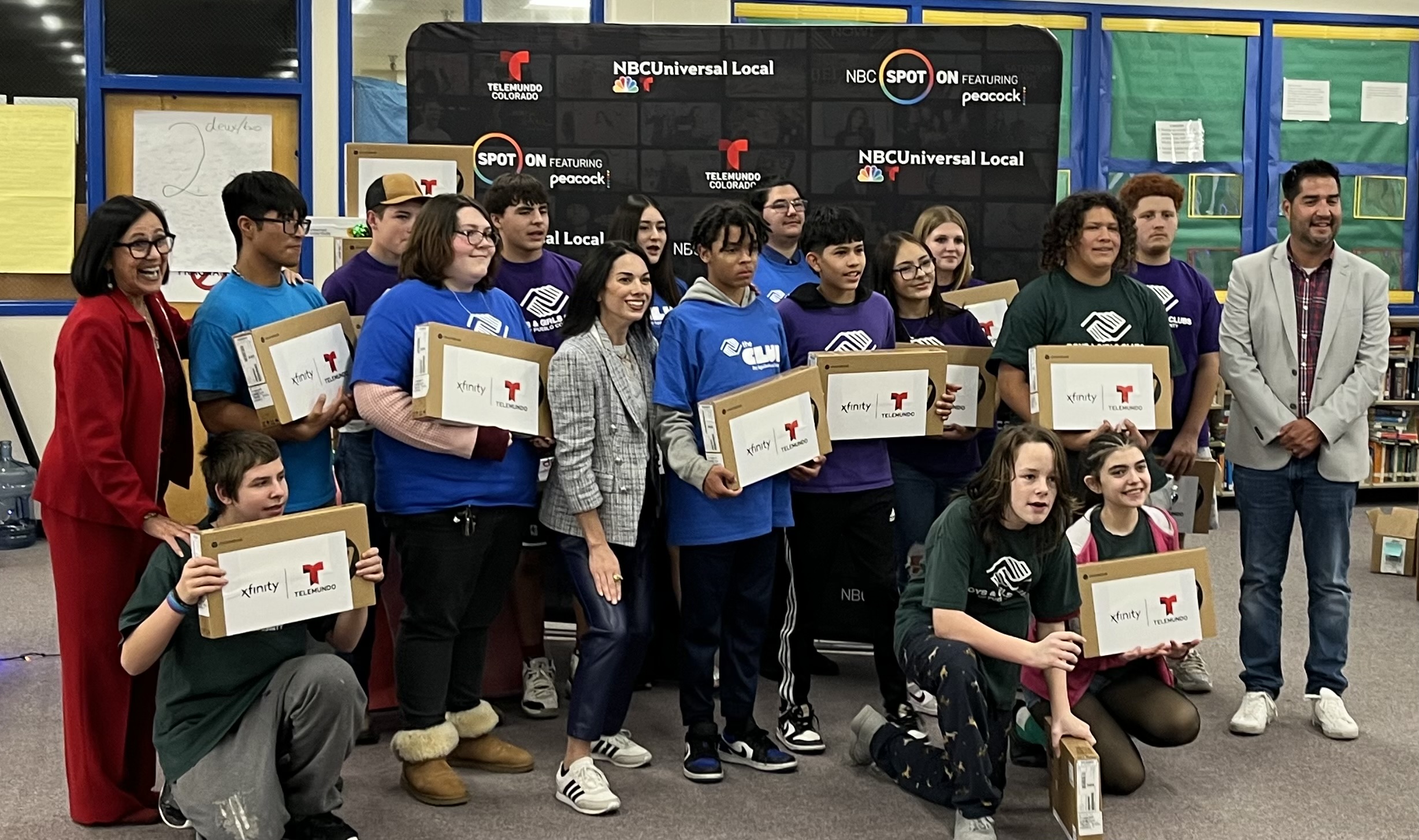 Students with their new laptops at the Boys & Girls Clubs of Pueblo County holiday event.